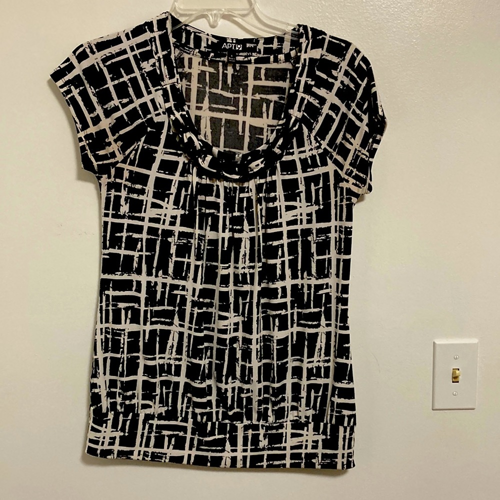 Black and white small blouse that fits more like a medium.